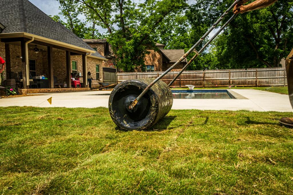 Lawn roller being used on a garden lawn