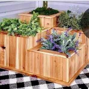 Tiered wood planter box with plants by Petal's Leaf